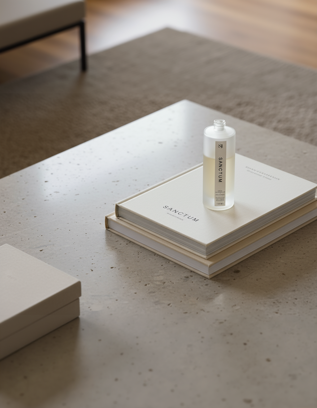 Bottle of Sanctum on a stack of books on a concrete surface