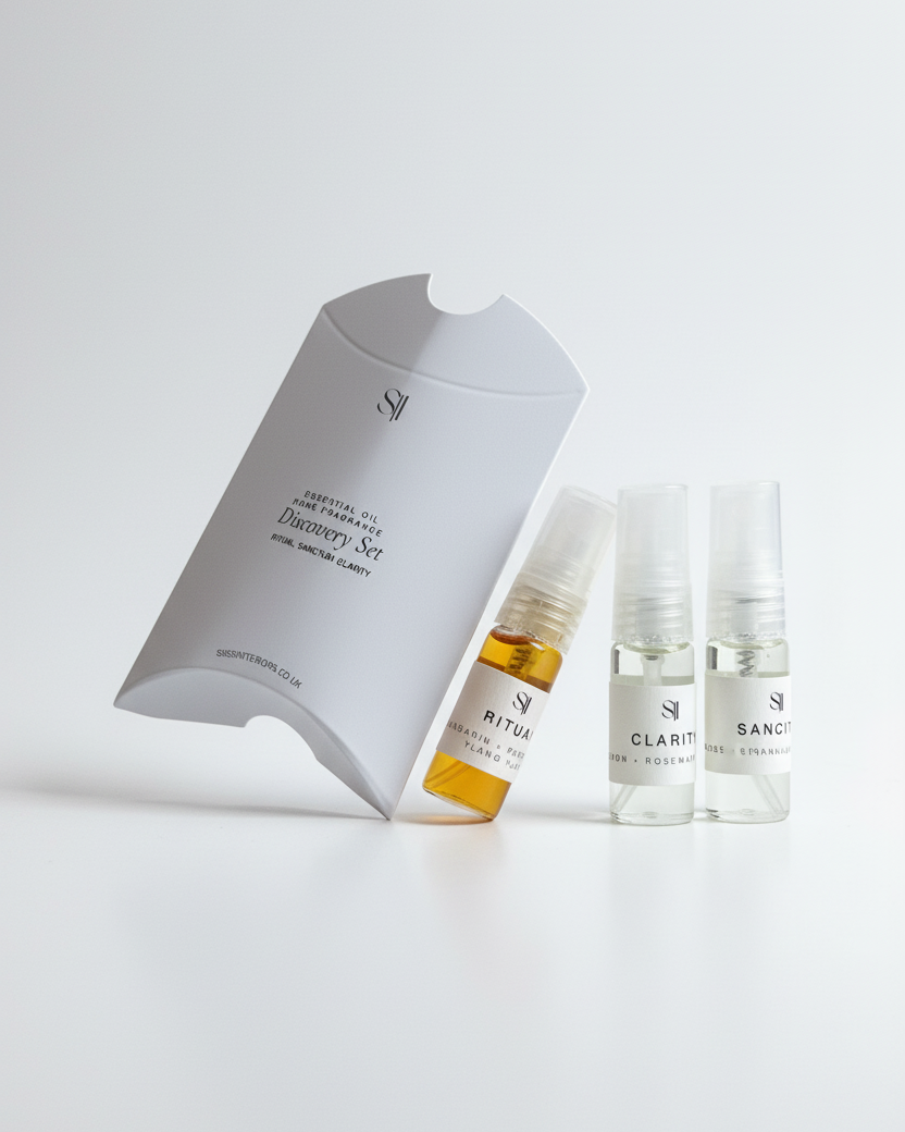 home fragrance product set with three bottles and a box on a white background