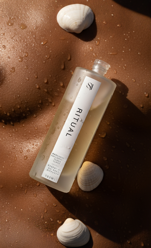 Ritual bottle on a wet surface with shells